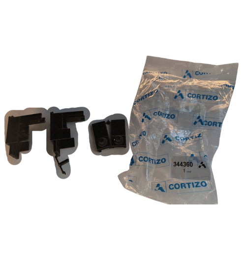 Two black plastic components and a clear plastic bag with 'Cortizo' branding on a white background.