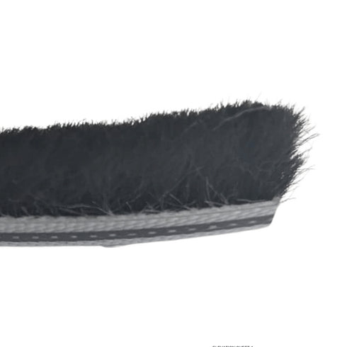 Close-up of a black brush with bristles on a white background