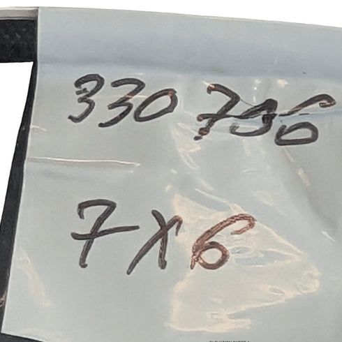 Clear plastic sheet with handwritten measurements '330 736' and '7 x 6'.