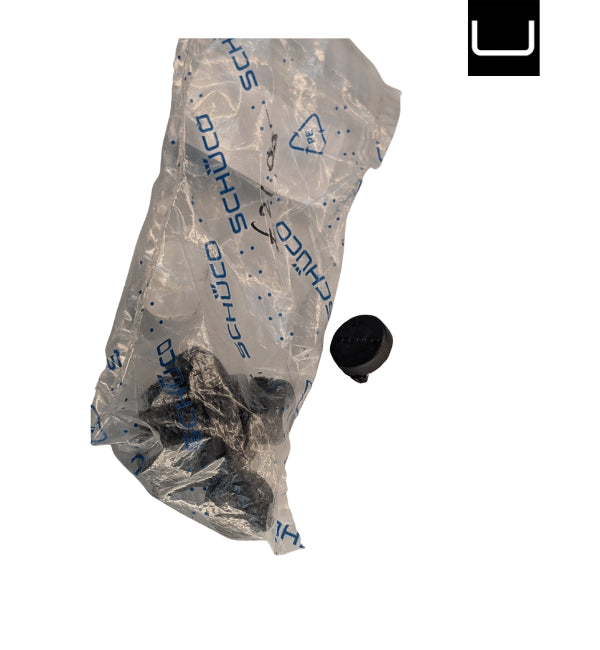 Schuco packaging with a black object on a white background