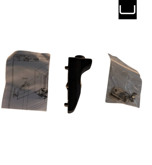 Black gun grip and two plastic components on a white background