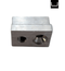 Metallic block with two cylindrical holes on a white background