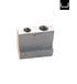 Metal block with two cylindrical holes on a white background