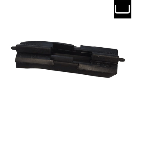 Black plastic component on a white background