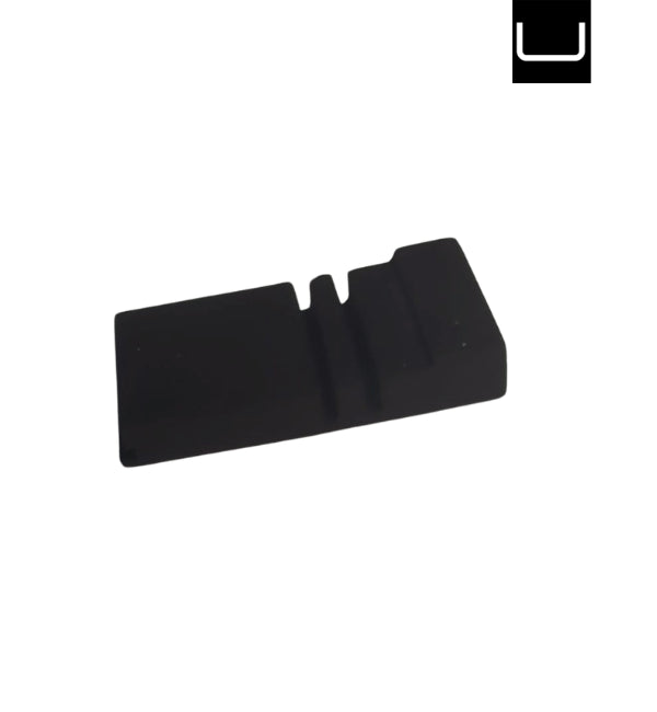 Black plastic component on a white background