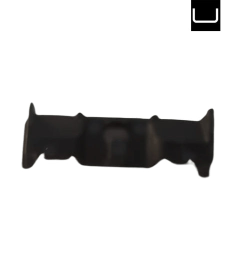Black plastic component on a white background
