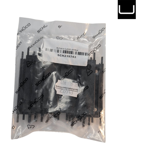 Packaged Schuco latch assembly with labels on a white background