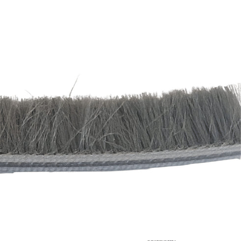 Close-up of a strip of synthetic bristle brush on a white background