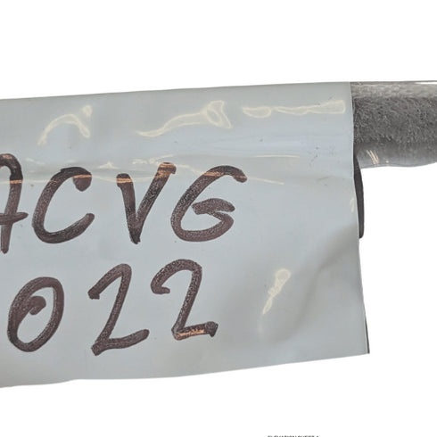 Metallic cable with 'ACVG 022' marking on a white background