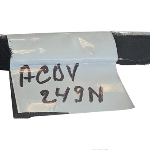 Black object with a transparent label displaying 'ACOV 249N' on a white background